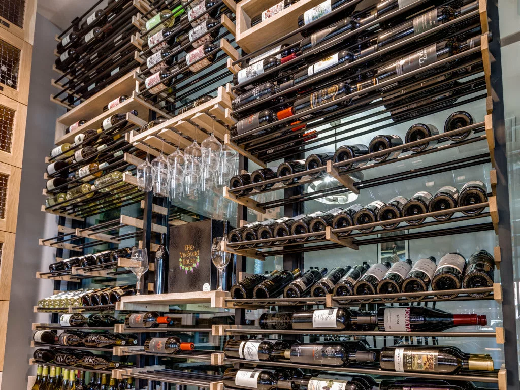 Premium mahogany and walnut wine racks for UK cellars.